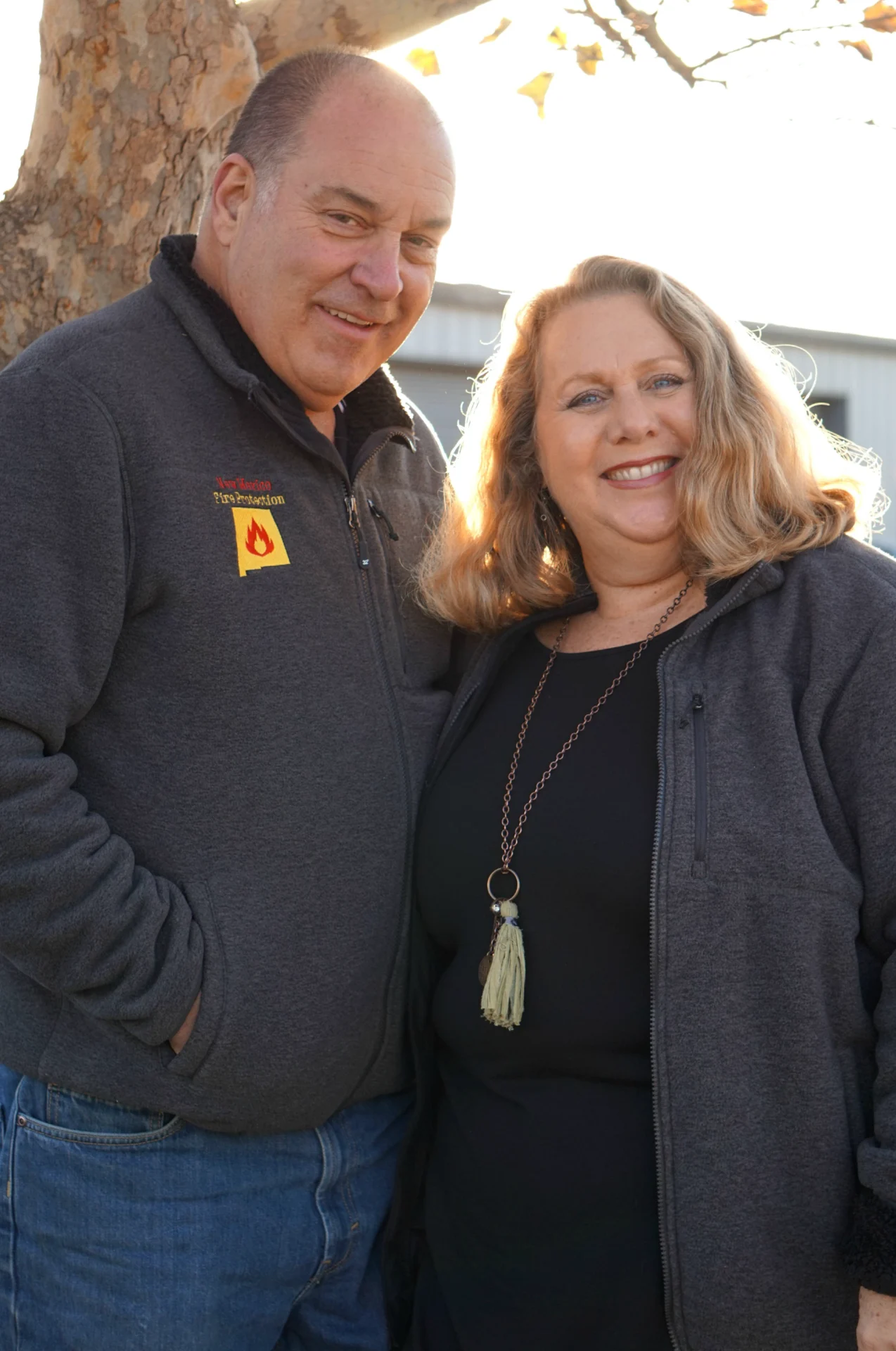 A man and woman standing next to each other.